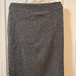 Grey tweed skirt hits below the knee